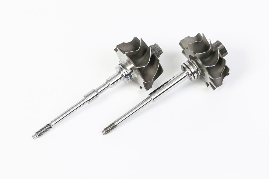 two turbocharger main shafts with main shaft seal fitted