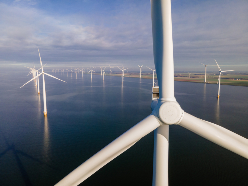 Offshore,Windmill,Park,With,Clouds,And,A,Blue,Sky,,Windmill